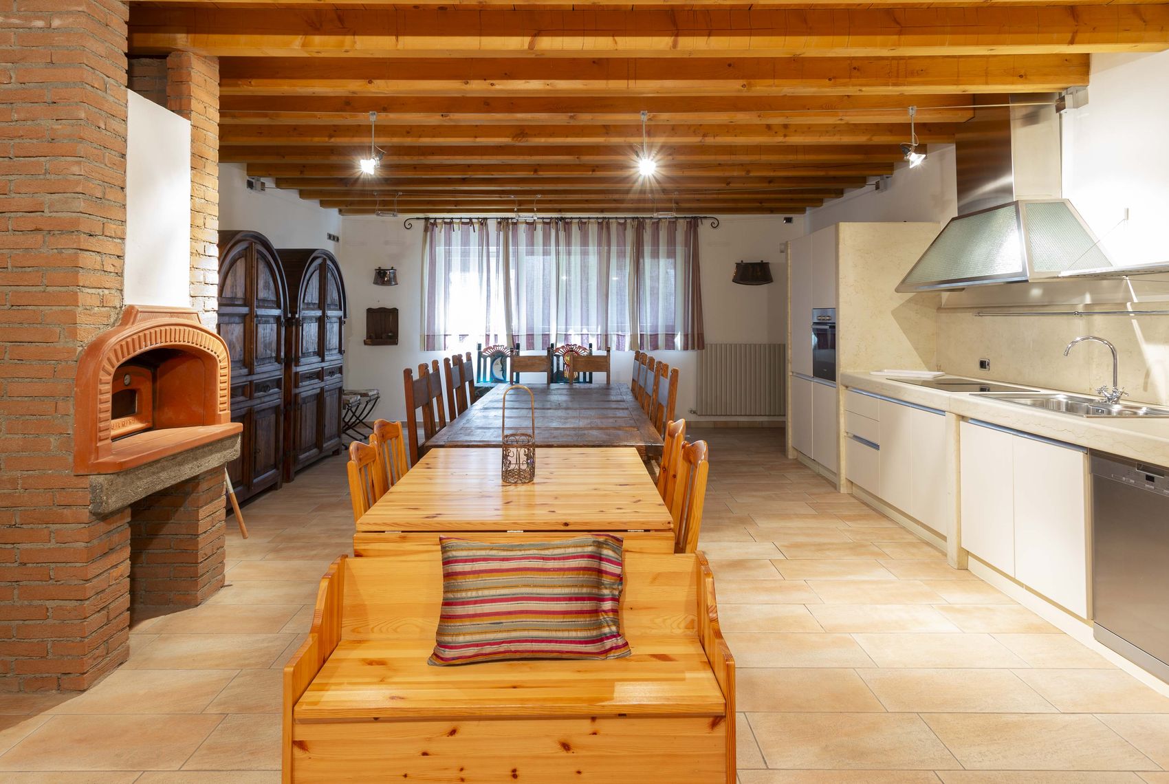 The taverna's pine benches along the long table