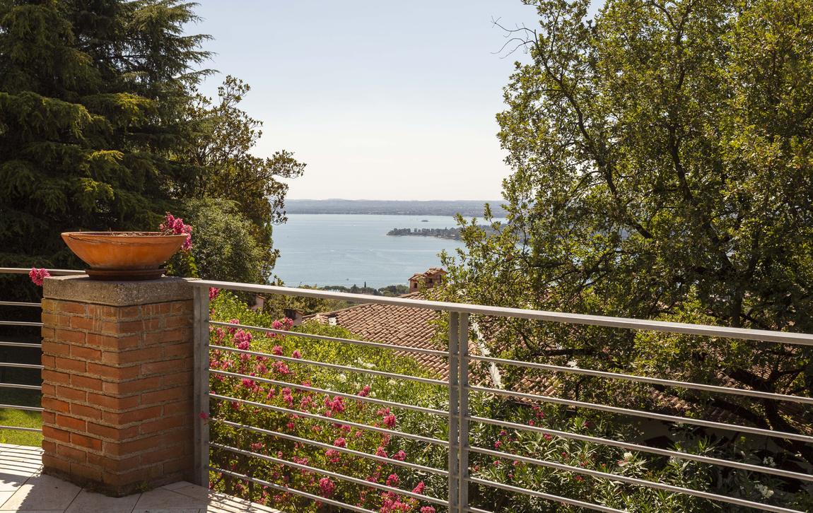 The lake seen from the terrace railing between terracotta bowls